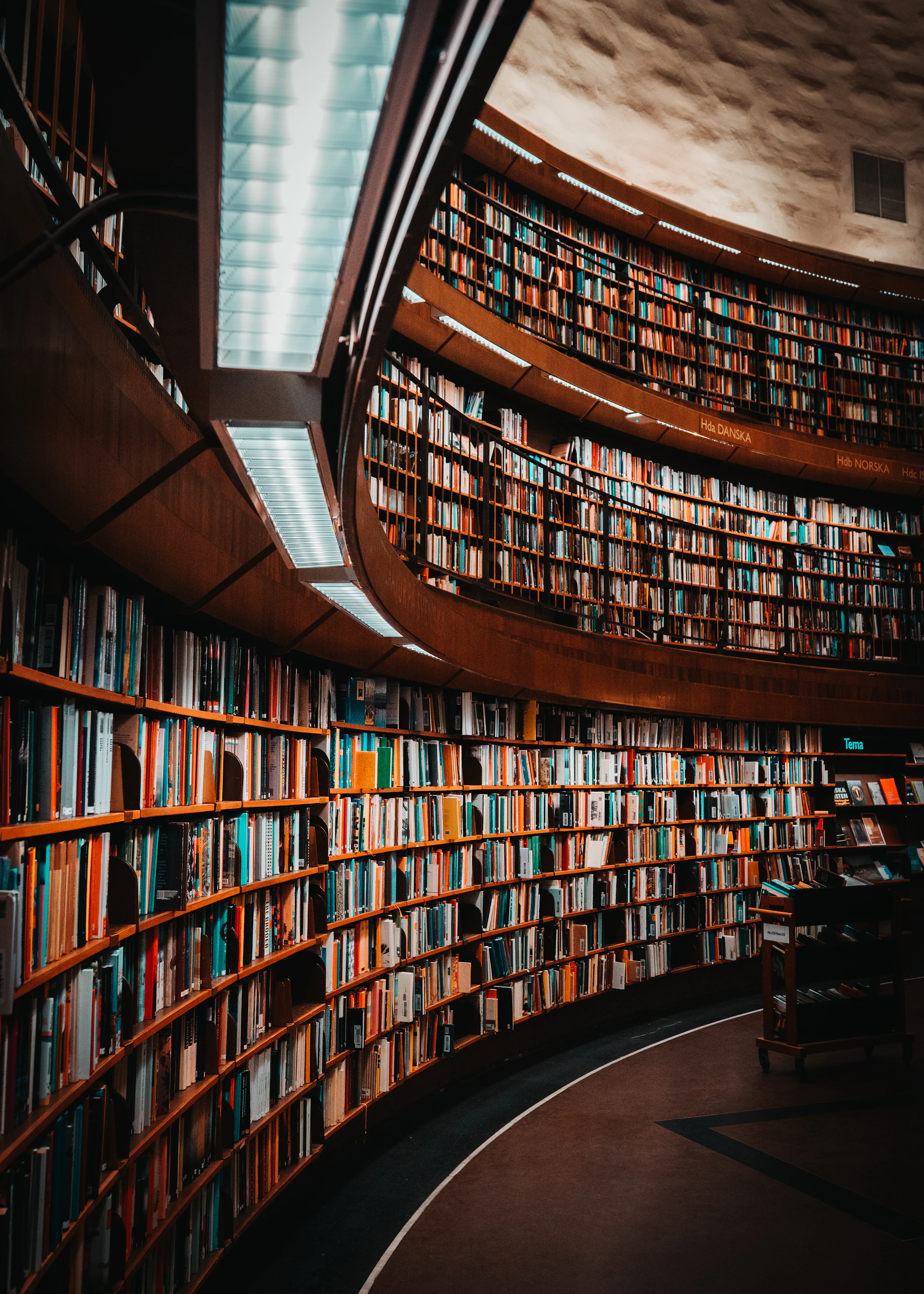 A circular library with shelves rising to the ceiling